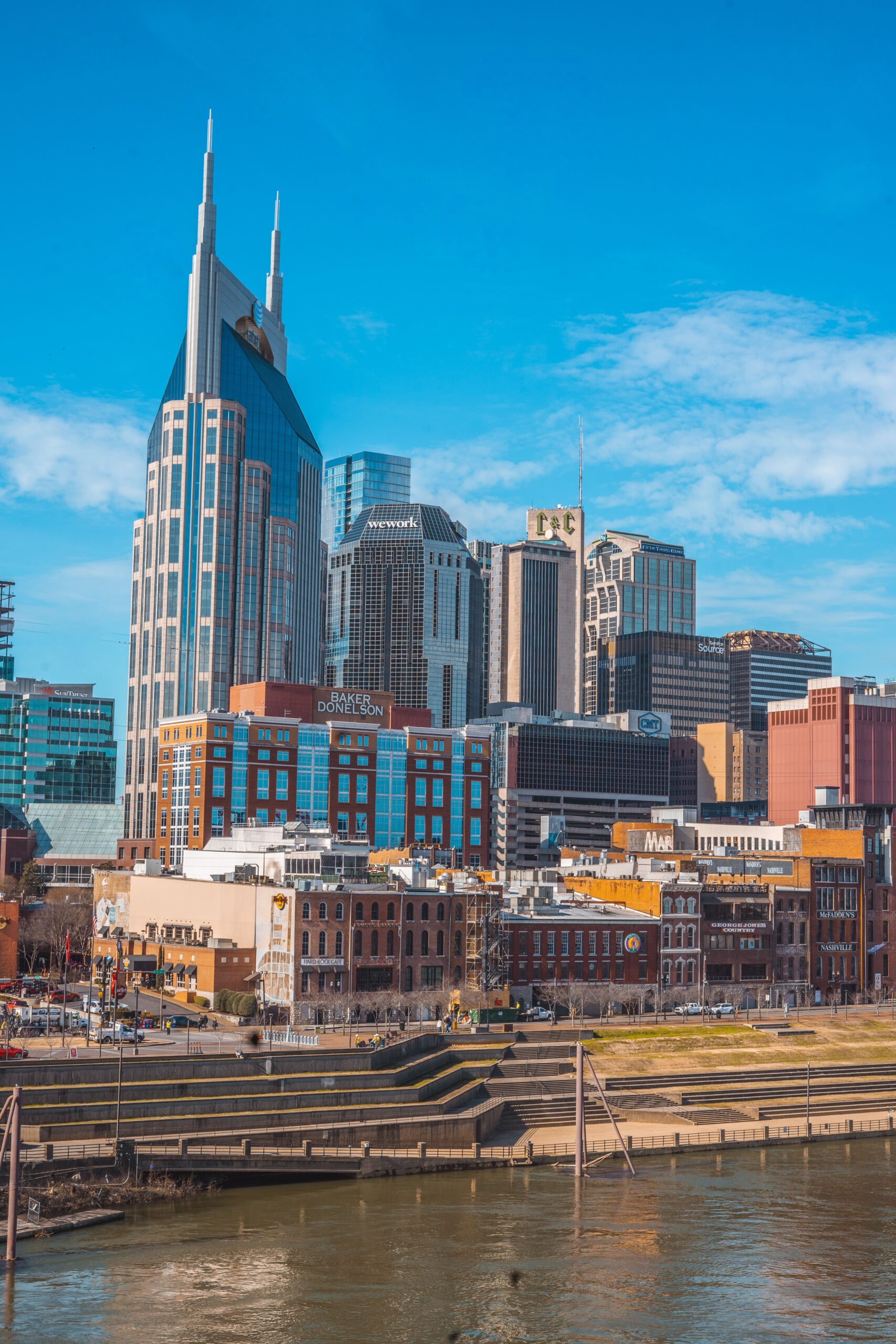 Vibrant daytime view of Nashville's skyline featuring iconic skyscrapers and architecture.